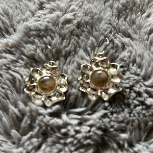 Silver flower with cats eye in the center